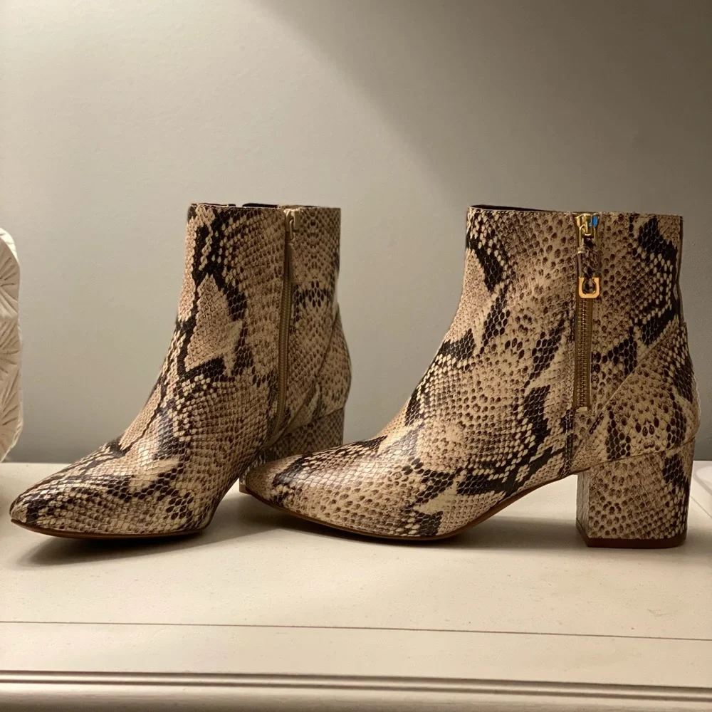 Size 9 Cole Haan sightly textured snake skin booties with gold accents. - Picture 1 of 6